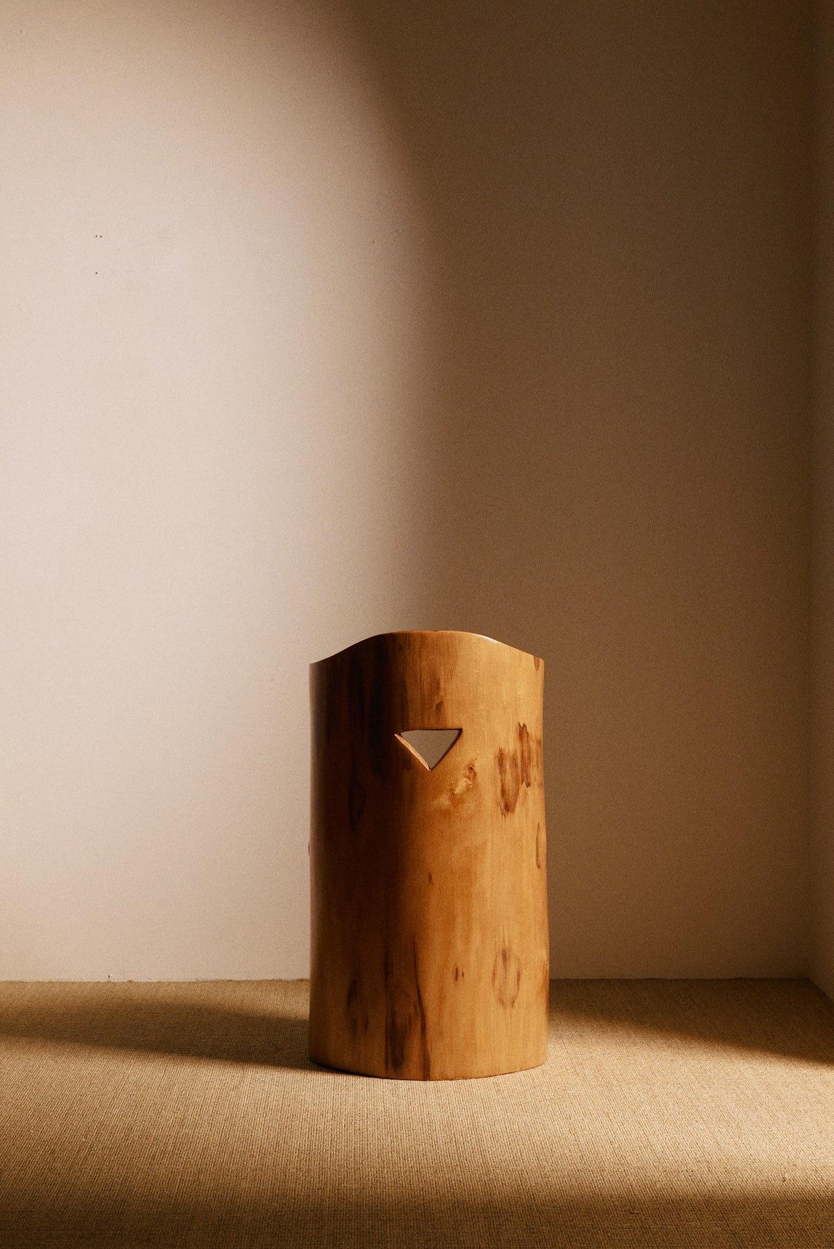 Swedish sculptural pine armchair, back view showing the triangular cutout