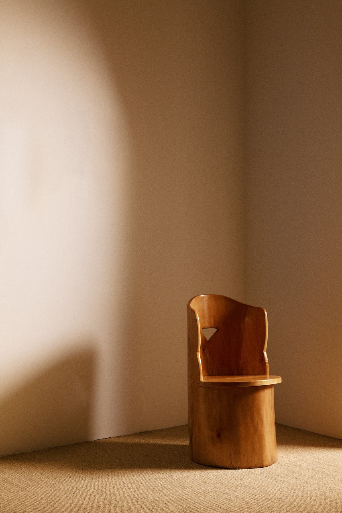 Swedish sculptural pine armchair, angled front view