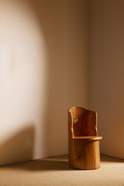 Swedish sculptural pine armchair, angled front view