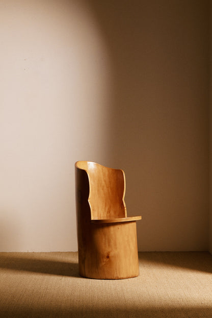 Swedish sculptural pine armchair side view