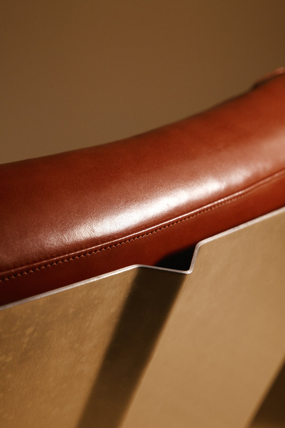 Xavier Féal cognac leather lounge chairs, close view of the stitched seat front edge