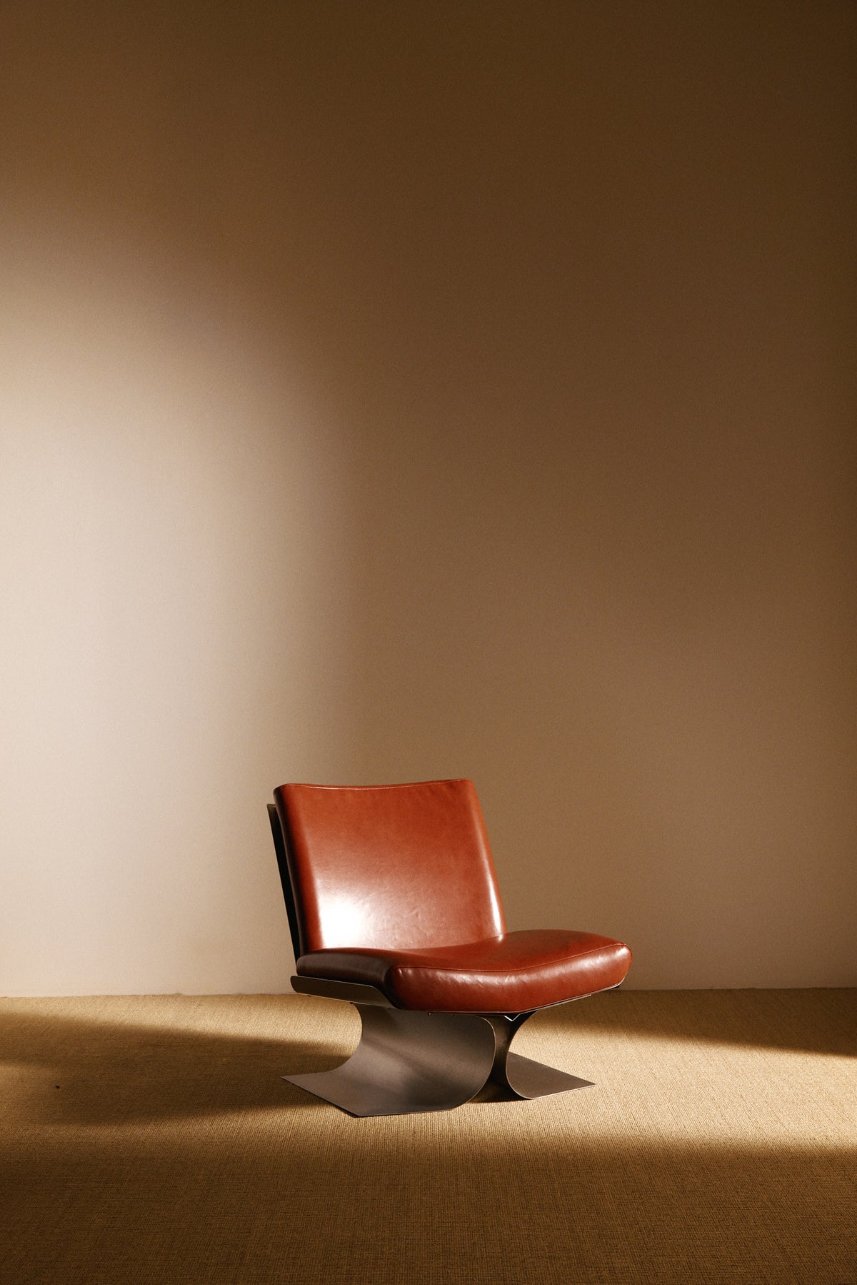 Xavier Féal cognac leather lounge chairs, single chair, angled front view