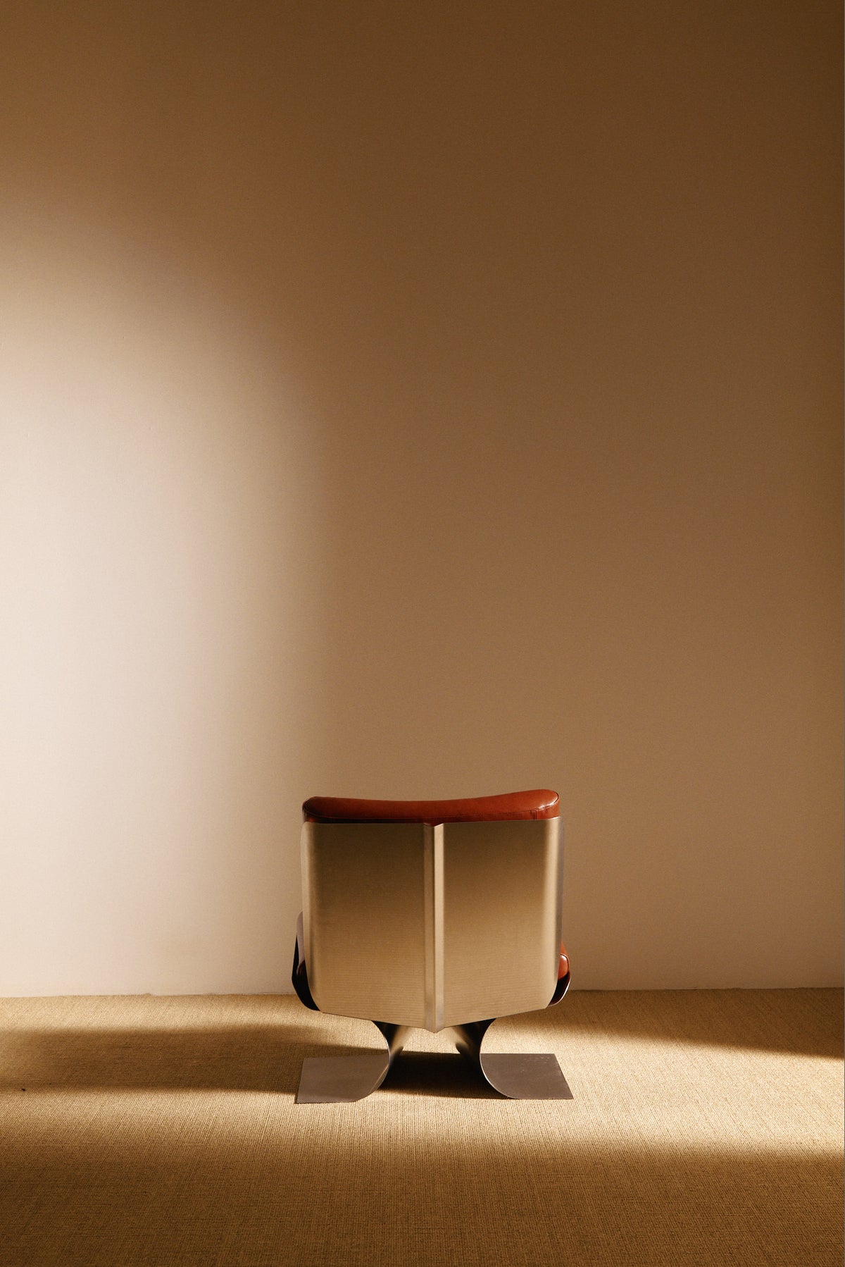 Xavier Féal cognac leather lounge chairs, single chair from behind