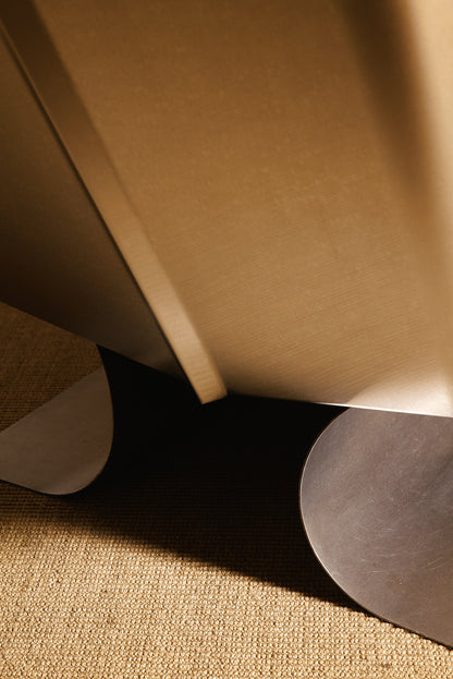 Xavier Féal cognac leather lounge chairs, close view of the curved steel base